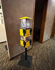 Yellow gumball machine in dental office hallway